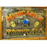 A pine framed advertising wall mirror for Newcastle Brown Ale, full dimensions 66 x 90cm