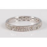 A contemporary 18ct white gold diamond eternity ring, arranged as two rows of pavé set diamond