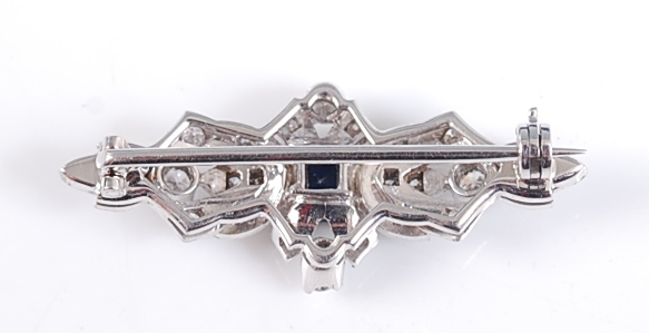 A white metal Art Deco style lozenge shaped brooch, featuring a centre square cut sapphire within - Image 2 of 3