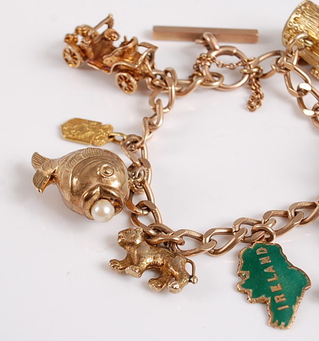 A 9ct yellow gold curb link charm bracelet, the charms to include an opening treasure chest, a Union - Image 2 of 2