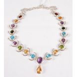 A contemporary silver and multi-gem set fringe necklace, the oval cut stones to include amethyst,