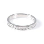 A platinum diamond half hoop eternity ring , featuring 20 round brilliant cut diamonds in channel