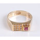 A yellow metal, ruby and diamond rectangular signet ring, featuring a square cut ruby and eleven