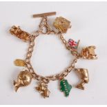 A 9ct yellow gold curb link charm bracelet, the charms to include an opening treasure chest, a Union