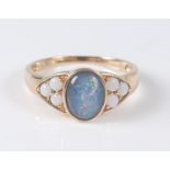 A 9ct yellow opal triplet dress ring, the opal triplet cabochon measuring approx 9 x 6.7 x 3mm, in a