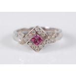 A 9ct white gold crossover style ruby and diamond square cluster ring, featuring a centre panel of