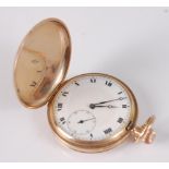 A gent's 9ct gold cased full hunter pocket watch, the plain case with gold inner back cover, the