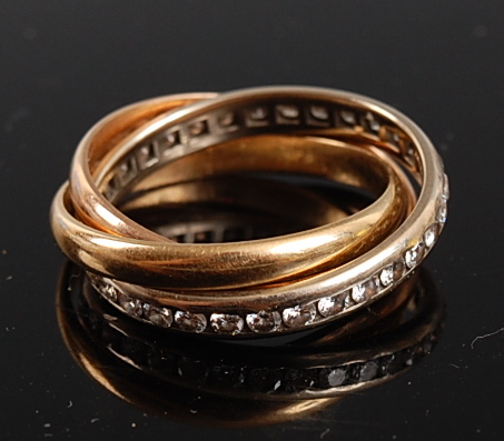 A yellow, white and rose metal Russian wedding ring , the white band channel set with 32 round