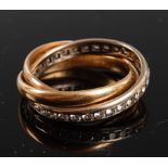 A yellow, white and rose metal Russian wedding ring , the white band channel set with 32 round