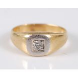 A yellow and white metal square signet ring, inset with a round brilliant cut diamond, diamond