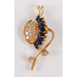 A yellow metal, sapphire and diamond set pendant, arranged as a stylised flower head pavé set with