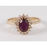 A 9ct yellow gold, amethyst and diamond cluster ring, the oval cut amethyst measuring approx 7.1 x