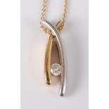 An 18ct yellow and white gold wishbone pendant, with a tension set round brilliant cut diamond,