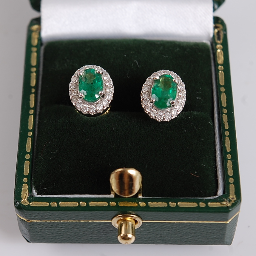 A pair of 18ct yellow and white gold oval emerald and diamond cluster earrings, in claw settings, - Image 2 of 3