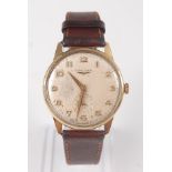 A gents 9ct yellow gold Longines 17 jewel manual wind wristwatch, with round champagne Arabic dial