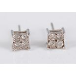 A pair of 9ct white gold diamond square cluster earstuds, each with four round brilliant cut