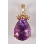 A 14ct yellow gold pear shaped amethyst and diamond pendant, the amethyst in a three-claw setting