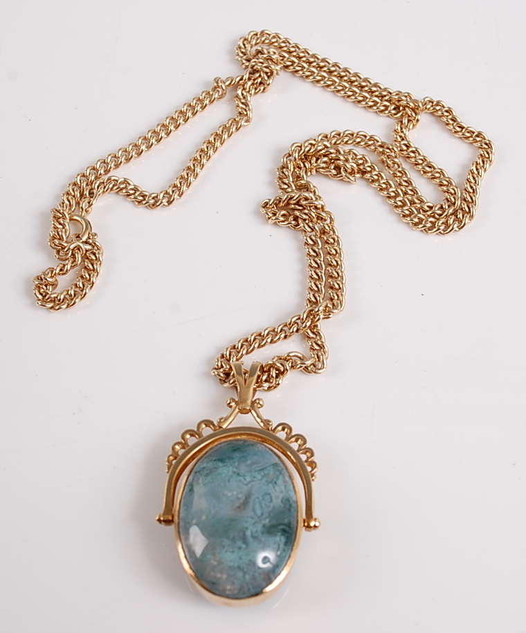 A 9ct yellow gold swivel fob pendant, featuring an oval moss agate cabochon to one side and a blue - Image 2 of 2