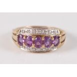 A yellow metal, amethyst and diamond three row dress ring, comprising a centre row of five oval