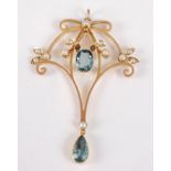 An Edwardian 15ct gold, blue topaz and seed pearl set openwork pendant, 4.3g, 45mm