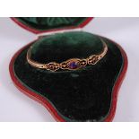 A circa 1900 9ct gold and amethyst set expanding link bracelet, gross weight 6.4g, 155mm, in