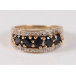 A 9ct yellow gold, sapphire and diamond half hoop eternity ring, the centre row with five oval