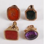 An assortment of four rose and yellow metal fob seals, comprising an octagonal cut bloodstone