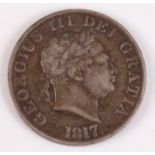 Great Britain, 1817 half crown, George III bull head, date below, rev; crowned quartered shields. (