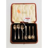 A set of six mid-20th century silver coffee spoons, in fitted red leather case, bearing label for