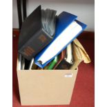 A box containing a schoolboy Stamp Album, albums of first day covers and other stamp albums