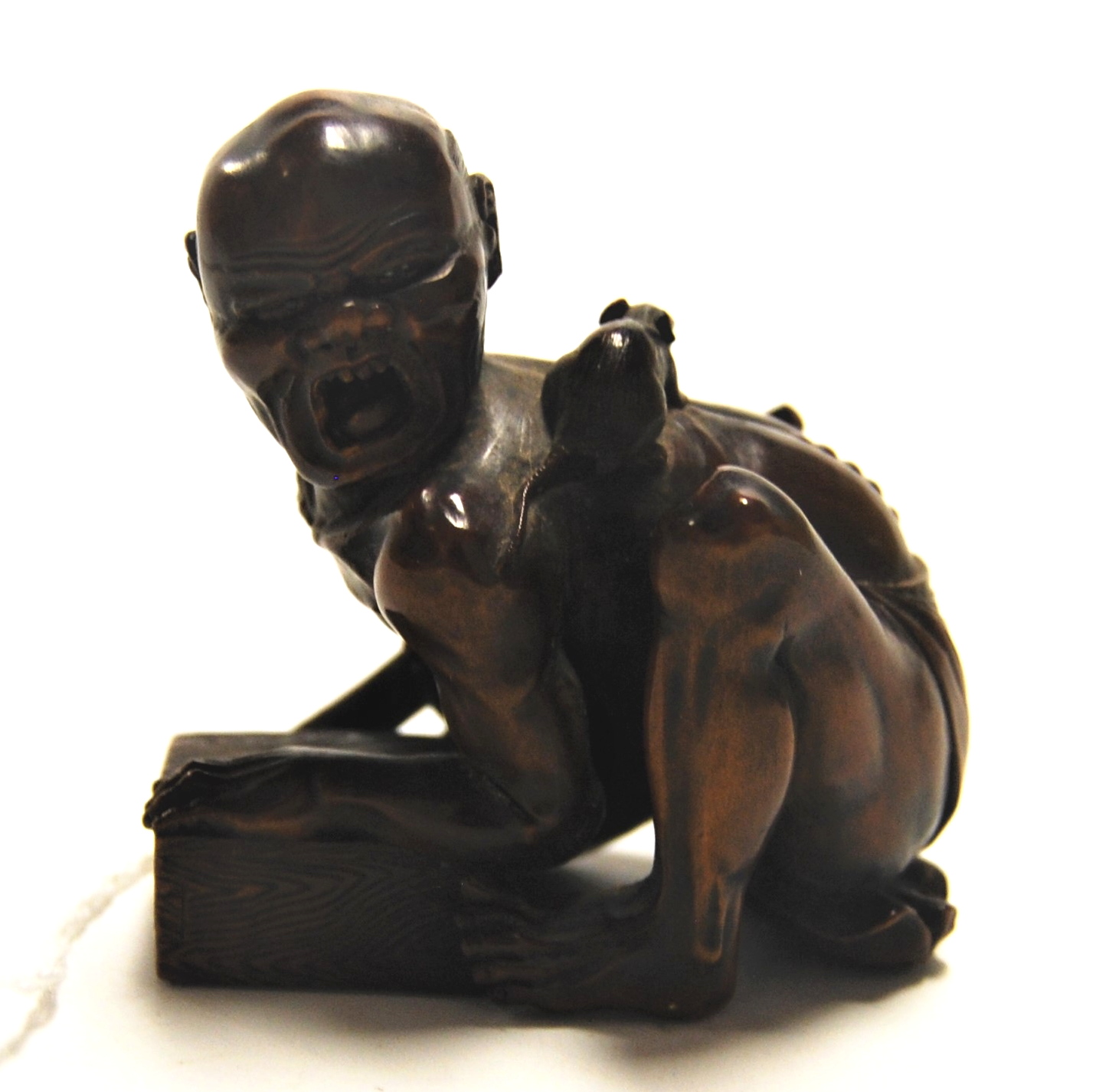 A Japanese Meiji period softwood netsuke, carved as a man in kneeling pose with rat upon his back, - Image 2 of 9