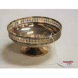 A George V silver pedestal bonbon dish, of circular form, having pierced rim, 5.9oz