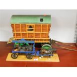 A scratch built model of a gypsy caravan together with a painted Charringtons coal wagon with