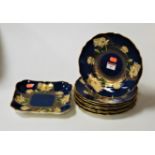 A Copeland Spode blue lustre part dessert service having floral decoration and heightened in gilt,