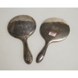 A Victorian silver backed hand mirror; together with another similar example (2)