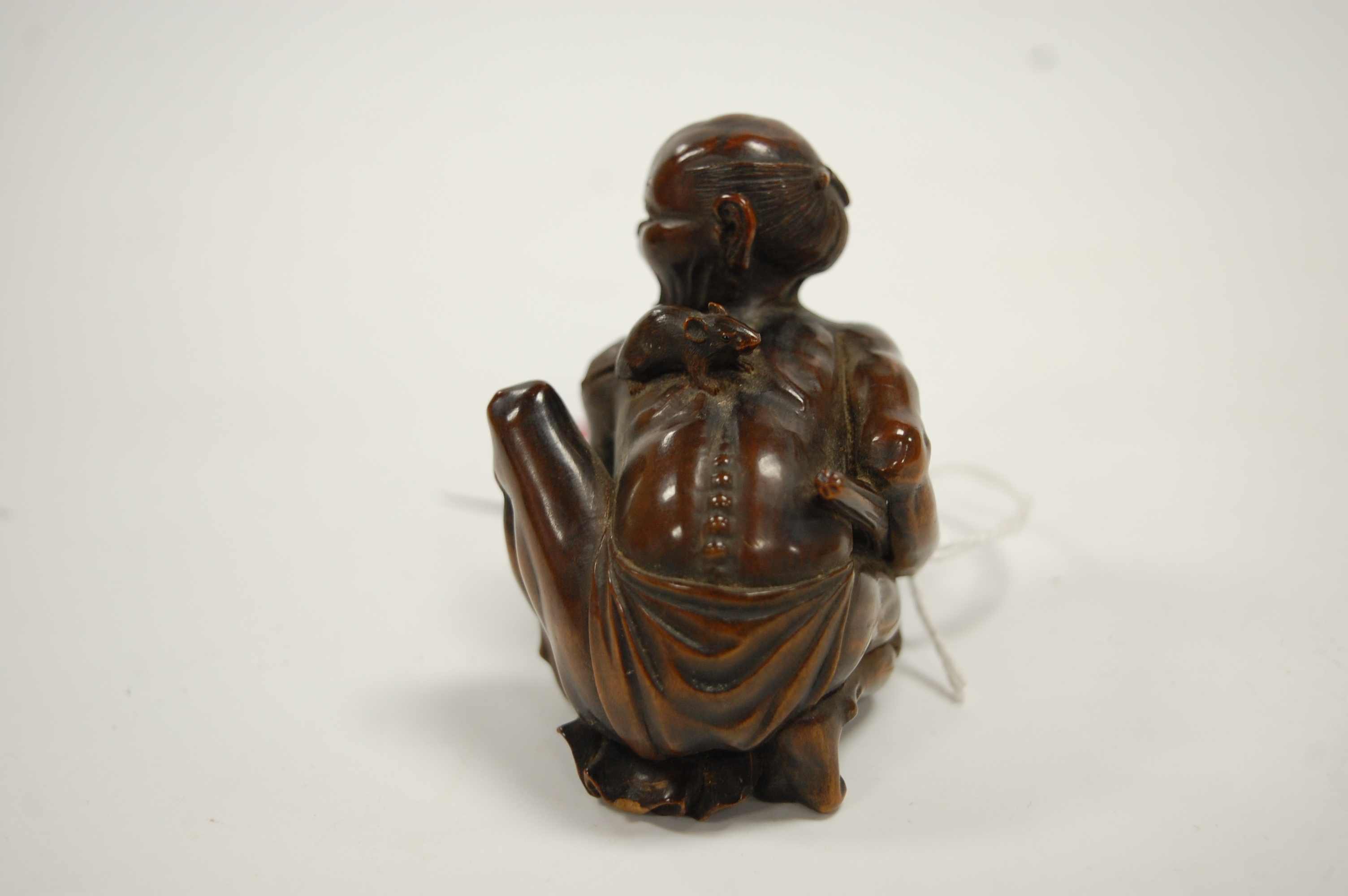 A Japanese Meiji period softwood netsuke, carved as a man in kneeling pose with rat upon his back, - Image 5 of 9