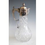 A modern cut glass and silver mounted claret jug, with Bacchus mask spout, the handle chased with