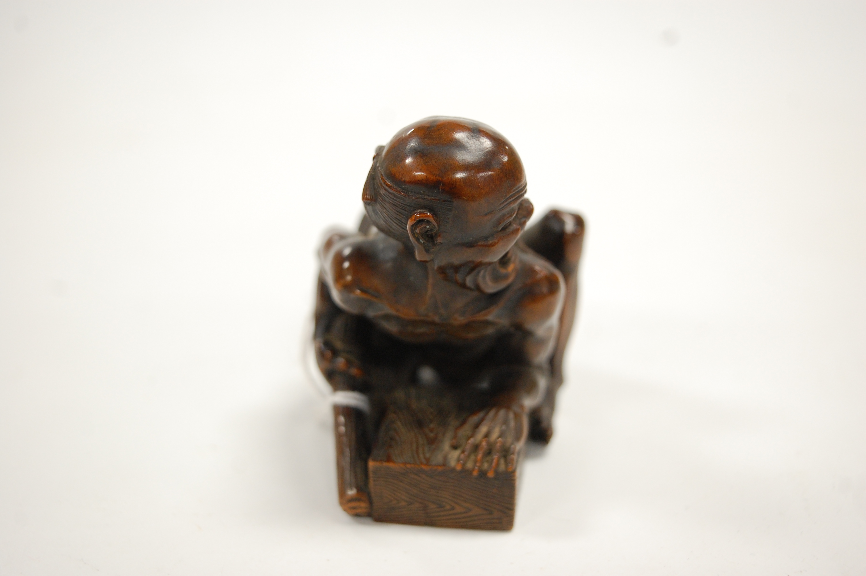 A Japanese Meiji period softwood netsuke, carved as a man in kneeling pose with rat upon his back, - Image 4 of 9
