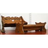 A Victorian stained beech book trough in the form of a bench having fret carved back and ends, width