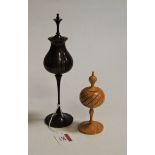 A turned beech pot pourri, having turned finial to a pierced circular body, on further slender