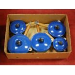 A graduated set of five LeCreuset blue enamelled saucepans and covers