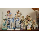 A pair of late 19th century continental porcelain figures of musicians, him in standing pose with