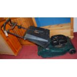 A Hayter Harrier 56 Intek Edge petrol driven lawn mower, with grass collecting box