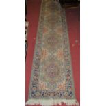 A Persian style machine woven green ground hall runner, 277 x 64cm