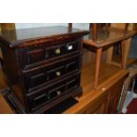 A small stained wood chest, of three long drawers; together with a retro coffee table; and a