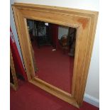 A contemporary pine framed rectangular wall mirror, having a deep border, 121 x 90cm