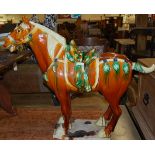 A large contemporary Tang style glazed pottery model of a standing horse, having removable tail