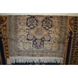 A small Persian silk hall rug, 105 x 69cm