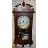 A reproduction mahogany droptrunk wall clock by Timemaster, having 31 day movement