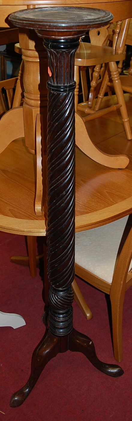 An early 20th century carved and spiral reeded mahogany pedestal plant stand, h.144cm